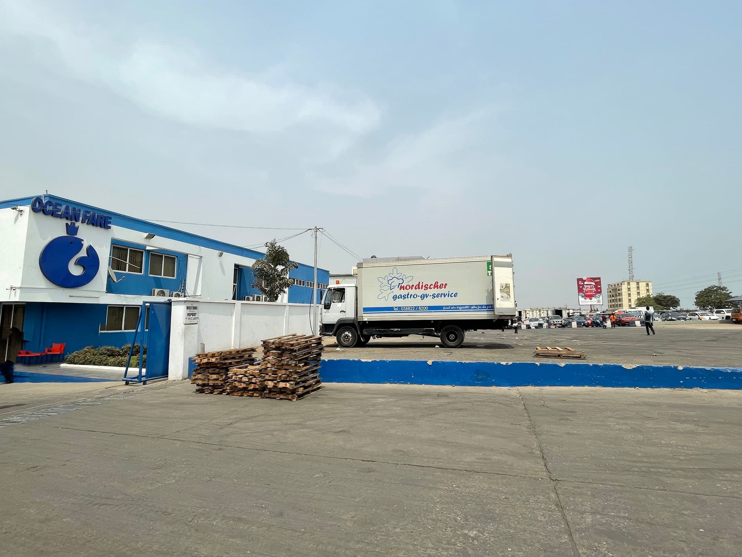 Ocean Fare main gate with a refrigerated delivery truck